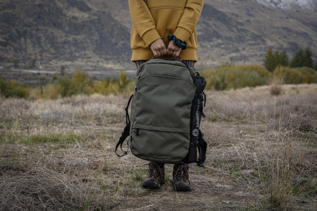 Person holding backpack